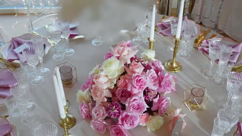 Elegant Table Setting with Flowers and Candles