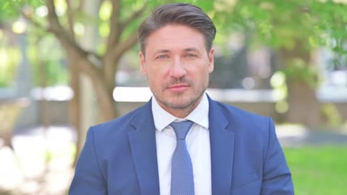 Handsome Man in Suit Looking at Camera