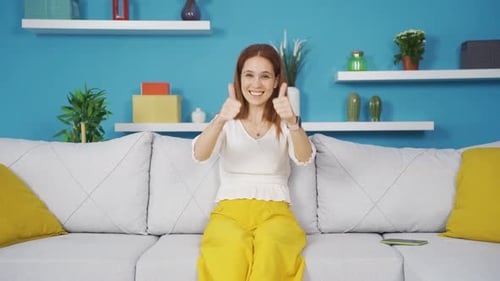 Enthusiastic Woman Clapping and Giving Thumbs Up