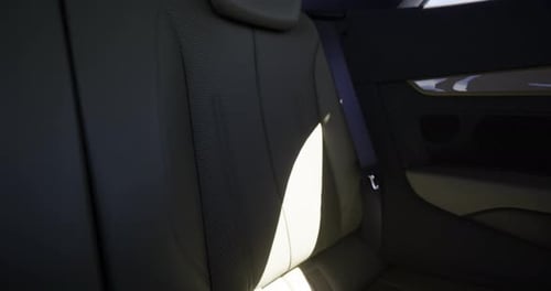 Modern Car Interior Back Seat Sunlight Upward Pan