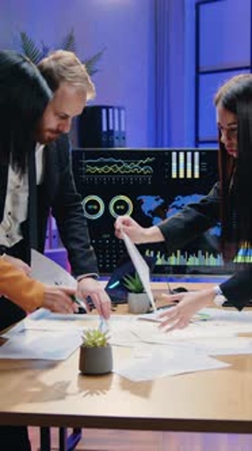 Likable Smiling Successful Experienced Male and Female Office Managers Discussing Presentation on