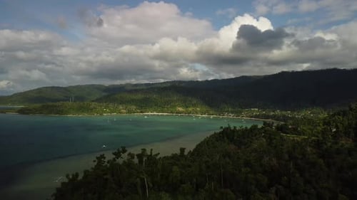 Aerial video over the coconut forests and beaches of Palawan
