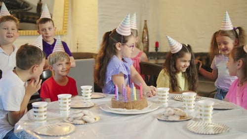 Children Celebrate Birthday Party With Cake and Friends