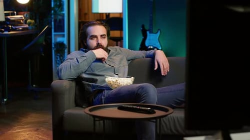 Man Relaxing at Home Watching TV