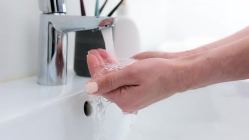 Woman Washing Hands at Sink, Close Up
