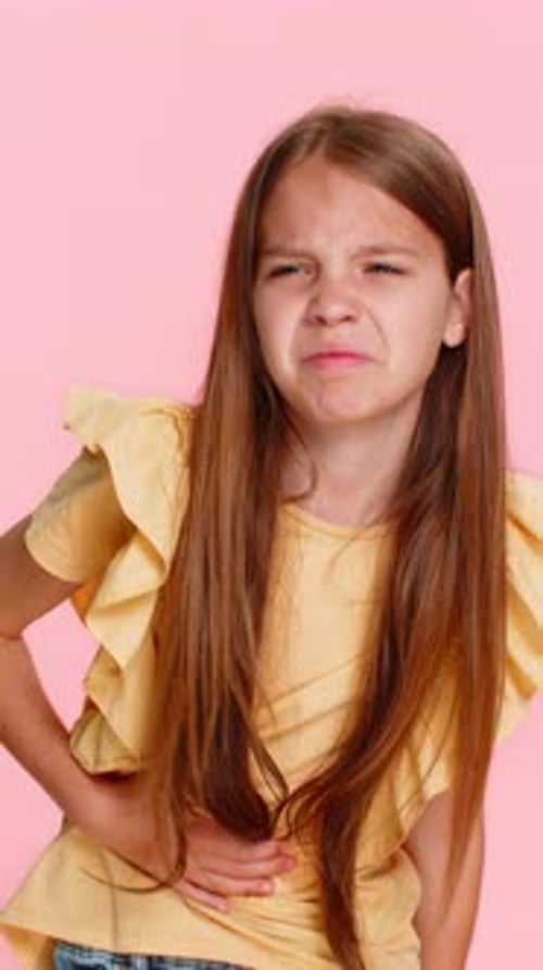 Child Girl Kid Holding Stomach in Pain with Scared Facial Expression Showing Illness and Discomfort