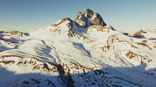 Snowy Mountain Peaks Bathing in Golden Light in the Pyrenees Fornegal Spain