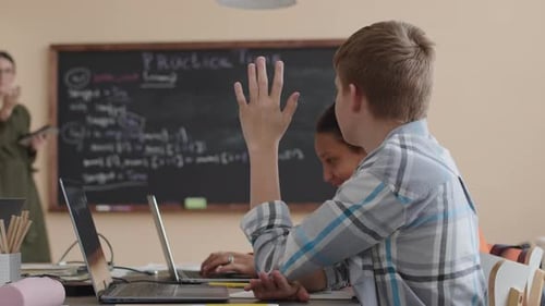 School Boy Asking Teacher Question during Programming Lesson