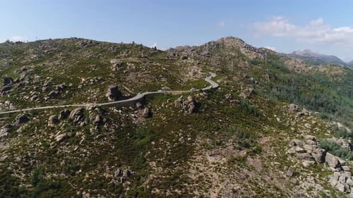 Road drone aerial view with cars passing on a road on landscape natural park in Geres, Portugal