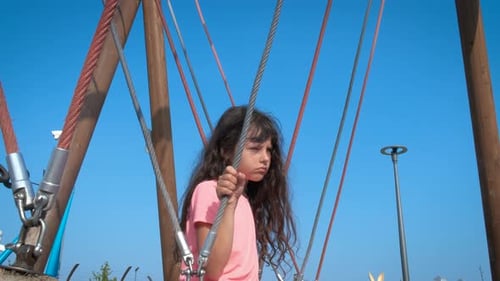 Child on Rope Swing at Urban Playground