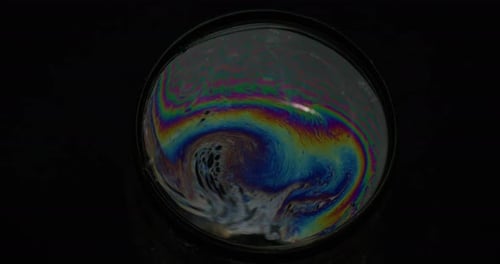 Abstract Swirling Soap Bubbles on Black Background