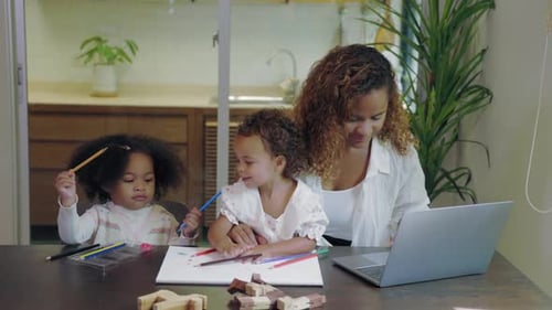 Mother and Children Drawing at the Table