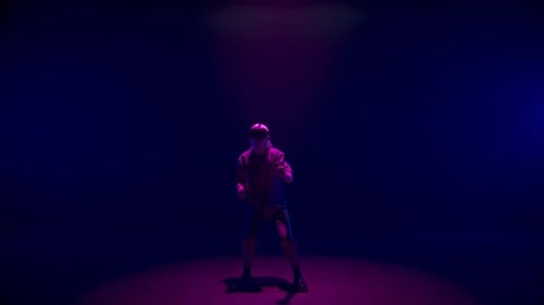 Man Wearing VR Headset Standing in a Dark Room