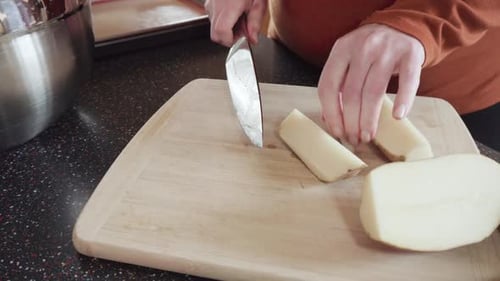 Preparing Potato Wedges on Baking Sheet in Oven