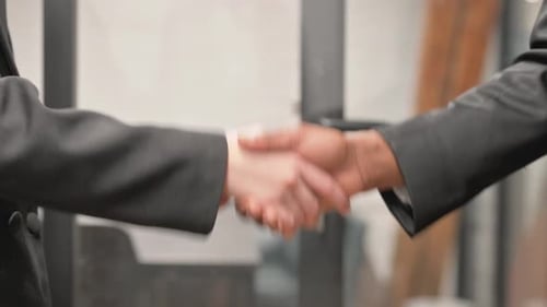 Close up of Handshake by Business People