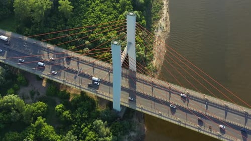 Beautiful top-down shot of traffic on modern cable stayed bridge. Rambler channel bright blue-green
