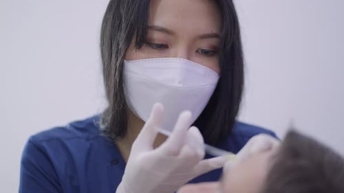 Doctor Giving Facial Injection