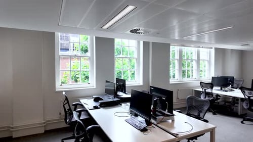 Empty Modern office space with desks and large windows setup