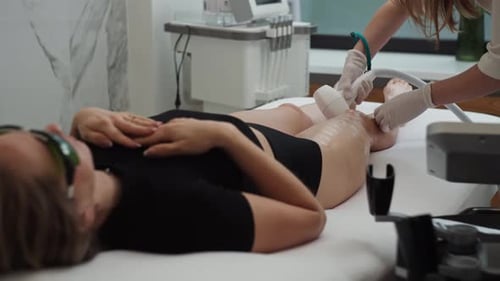 Depilation of Women's Legs with a Device in Cosmetology