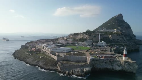 A wonderful high-flying drone shot showing the southernest point of Gibraltar at sunset with a singl