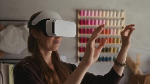 Female Fashion Designer with VR Headset Working on New Couture Collection