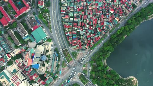 Drone, city and traffic on buildings, lake and transportation with infrastructure