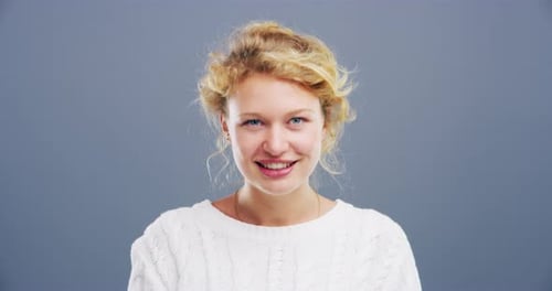 Blonde Woman Smiling and Winking Close-up