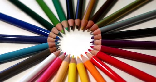 Group of color pencils isolated on white background texture top view.