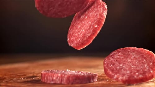 Slices of Sausage Falling in Slow Motion