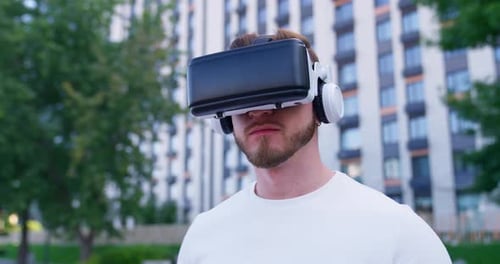 Young Adult Wearing Virtual Reality Headset Outdoors
