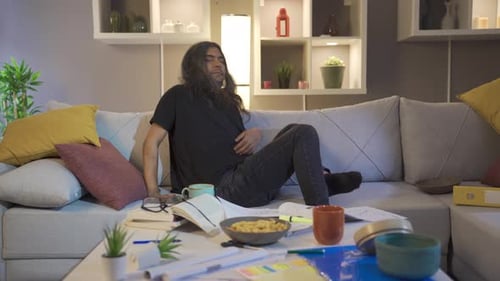 Stressed Person Relaxing and Meditating on Couch