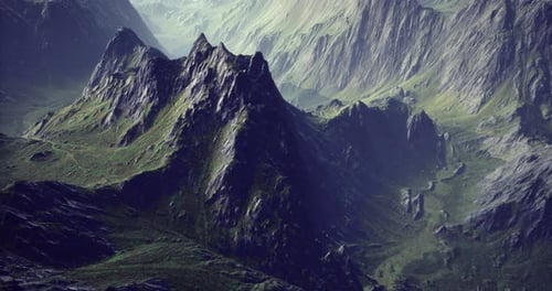 Majestic Mountain Range Illuminated By Soft Morning Light in a Serene Landscape