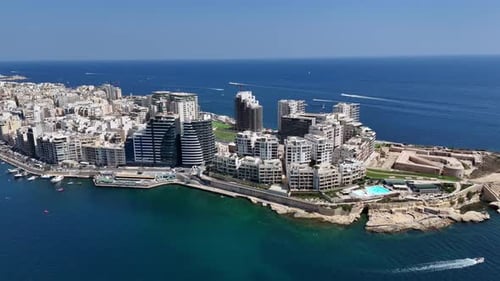 Aerial view of Sliema city. Buildings, apartments, blue sky, Mediterranean sea. Malta island