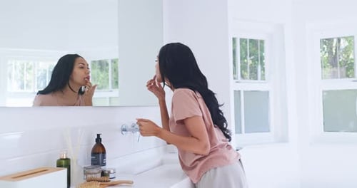 Home mirror, bathroom and woman with lips gloss hydration, lipstick application and morning routine