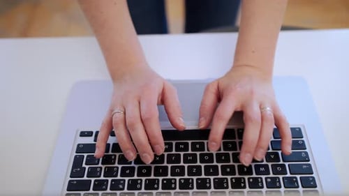 Unrecognizable businesswoman works on laptop in home office during quarantine