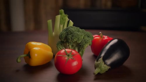 Fresh vegetables arranged on a dark surface