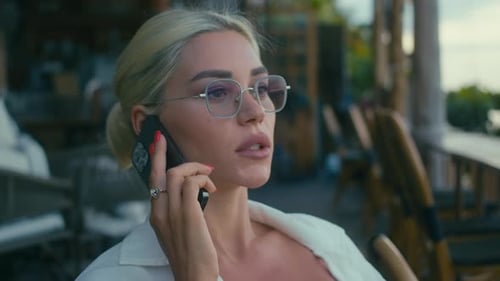 Blonde Woman Talking on a Cellphone Outdoor