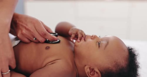 Baby Examined by Doctor with Stethoscope Close Up