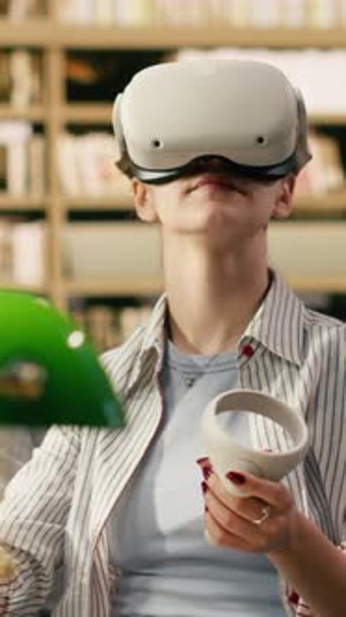 Vertical Video Student Using VR Device and Controller to Explore Immersive Learning