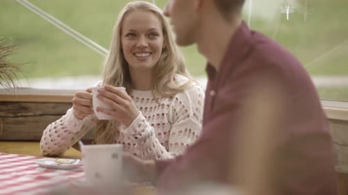 Young Couple Enjoying Coffee Together Indoors