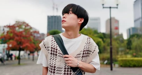 Japanese, man and thinking with walking in city, travel journey and adventure with thoughts outdoor