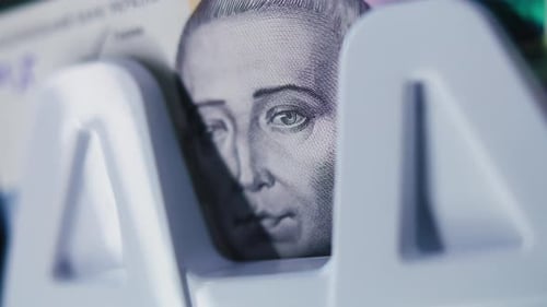 Close Up of Five Hundred Hryvnia Bill Lying in Money Counting Machine