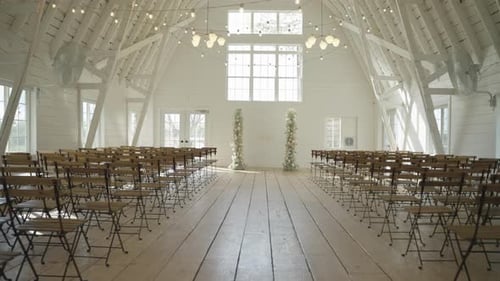 Elegant Wedding Venue Interior with Floral Pillars