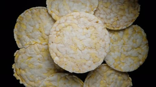 Overhead Shot of Rice Cakes on Black Background
