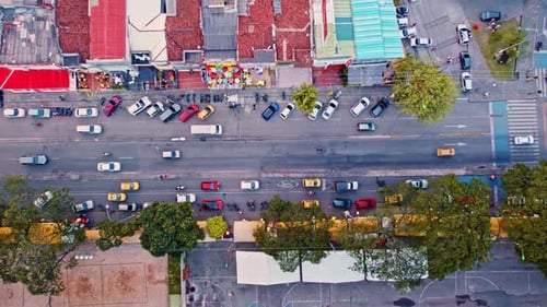 Aerial View of a Busy Street with Traffic and Market - Cali, Colombia