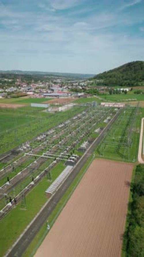Flying over high voltage substations with cables and pylons in Switzerland