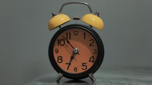 Old fashioned alarm clock ringing. Retro timepiece sounding the alarm in the morning.
