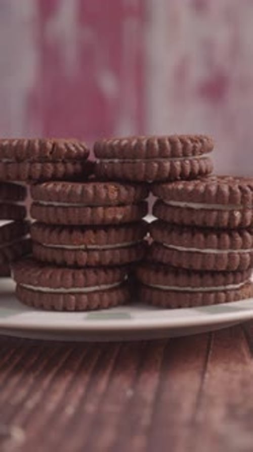 Stack of Chocolate Sandwich Cookies on Plate