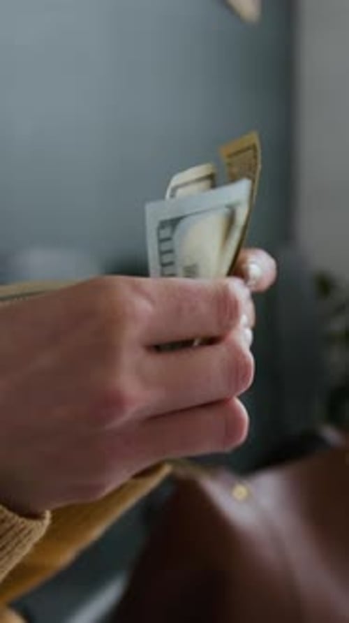 Close-up of Unrecognizable Hands Counting Stack of Cash