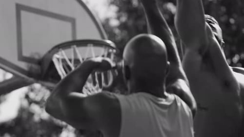 Basketball Player Shoots and Scores Action